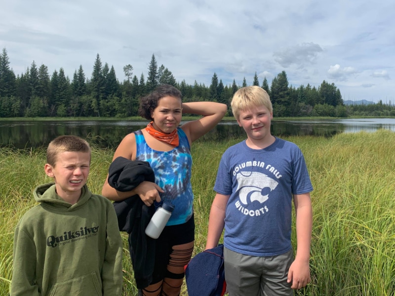 3 teens outside by the water